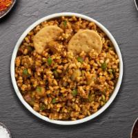 Best In Bhel Puri · Crispy mixture of puffed rice, sev, onions, and potatoes with tamarind and mint sauce.