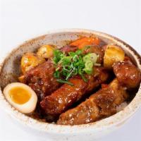Baby Back Rib Don · slow cooked baby back ribs (bone-on) with tamarind chili sauce over rice with half soft boil...