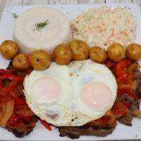 Bistek A Caballo · Grilled steak with sunny side up eggs & Colombian Sauce.Rice and  2 sides