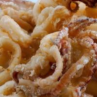 Calamari Fritti · Lightly floured and seasoned fried calamari, cooked golden brown, served with a tomato sauce.