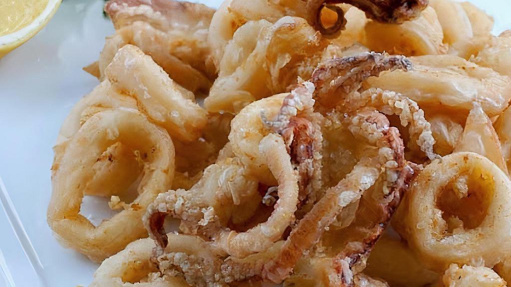 Calamari Fritti · Lightly floured and seasoned fried calamari, cooked golden brown, served with a tomato sauce.