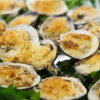 Baked Clams Oreganata · Littleneck clams filled with seasoned breadcrumbs in a scampi sauce.