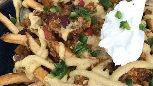 Chili Cheese Fries · Contains nuts. Tempeh-kidney bean chili, cashew cheese sauce, and sour cream, pickled jalapenos