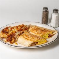 Breakfast Wrap · Scrambled eggs, bacon, and cheese. Served with home fries.