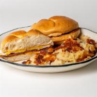 Hungry Man Special Egg Sandwich · Taylor ham, egg, and cheese on a hard roll. Served with home fries.