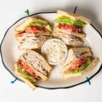 Turkey Club Wrap · Sliced turkey breast, bacon, lettuce, tomato, and mayonnaise.