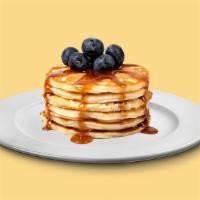 Bg04A. Blueberry Pancakes (3 Stack) · Fluffy golden pancakes with blueberries, served with butter and syrup.
