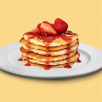 Bg05A. Strawberry Pancakes (3 Stack) · Fluffy golden pancakes with strawberries, served with butter and syrup.