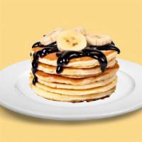 Bg06A. Banana Pancakes (3 Stack) · Fluffy golden pancakes with bananas, served with butter and syrup.