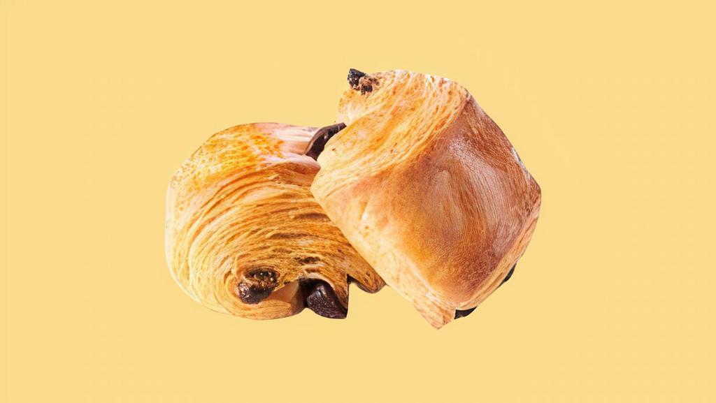 Chocolate Croissant  · Freshly baked chocolate croissant with a flaky, and buttery texture.