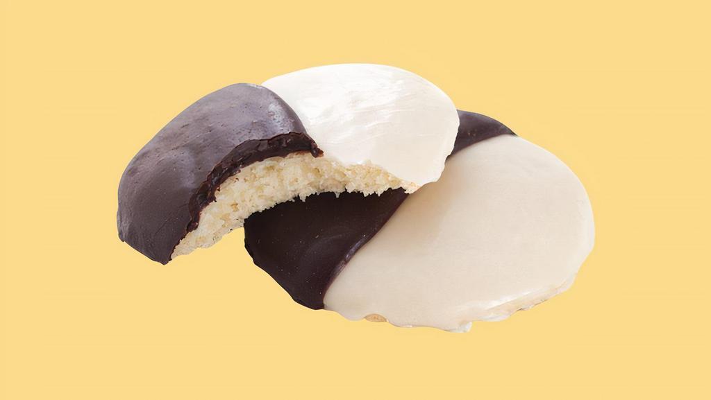 Black & White Cookie  · A New York tradition, these classic cookies combine a soft cake-like cookie with rich dark chocolate frosting and sweet, white fondant.