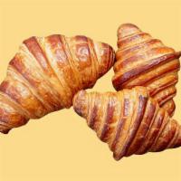 Croissant · Freshly baked croissant with a flaky, and buttery texture.