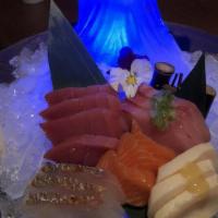 Sashimi Deluxe · 15 pieces. Served with soup or salad.