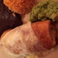 Chimichanga · Topped with Chihuahua cheese. Served with rice, beans, and guacamole.