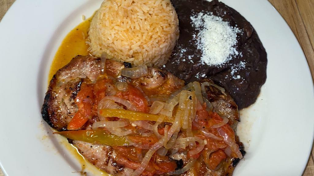 Pork Chops · Served with rice, beans and tortillas.