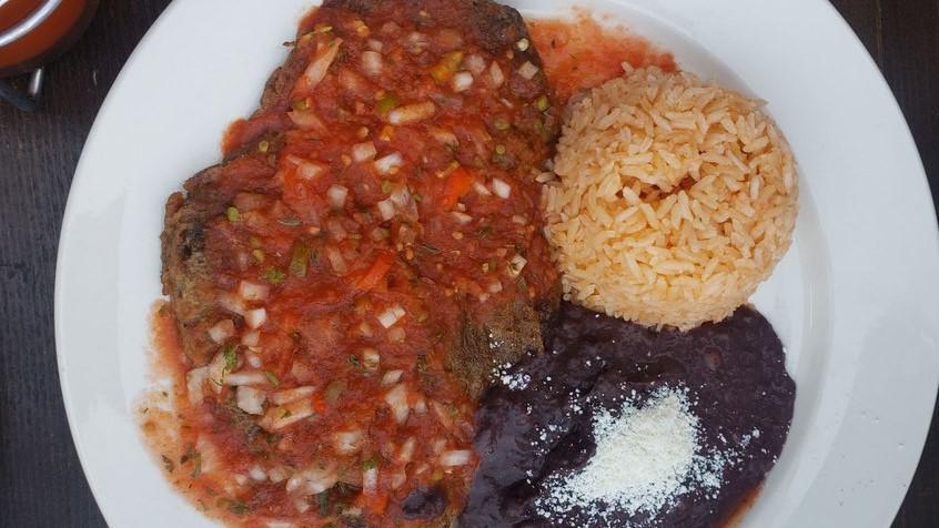 Chiles Rellenos · Stuffed poblano peppers with cheese. Served with rice, beans and tortillas.
