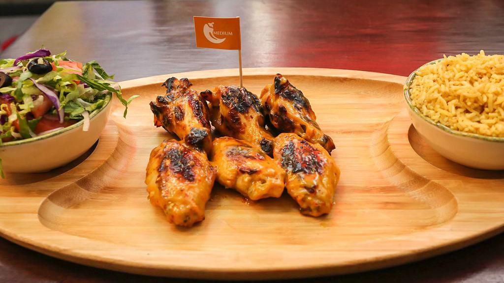 6 Piece Wings · Six flame-grilled wings with your choice of peri peri flavor.