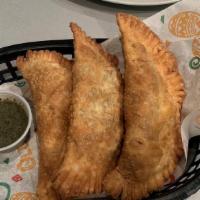 Homemade Empanadas · (3) Choice of Chicken & Cheese or Beef & Cheese. Served with chimichurri sauce.