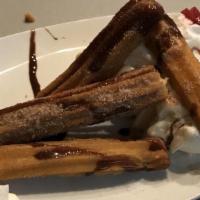 Churros A La Mode · Our house favorites. Mexican pastry coated with cinnamon sugar drizzled with chocolate syrup...