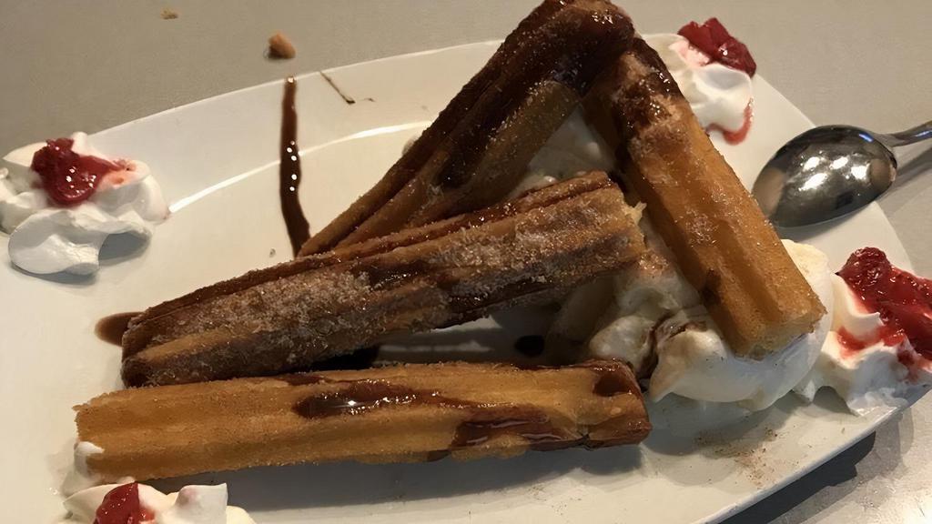 Churros A La Mode · Our house favorites. Mexican pastry coated with cinnamon sugar drizzled with chocolate syrup. Served with vanilla ice cream.