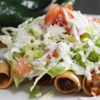 Flautas · Four Fried Crispy Tacos topped with sour cream, lettuce, tomato and cheese.
Served with jala...