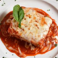 Baked Lasagna · Layers of pasta, ground beef, ricotta and mozzarella cheese.
