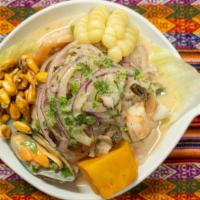 Ceviche De Pescado · Peruvian style fish marinated in lemon juice served with potato and corn.