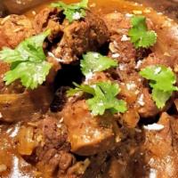 You Can'T Curry Love · Lamb cooked in ginger, garlic, and onion sauce. Served with basmati rice.