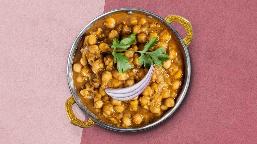 Holla Holla Chana Masala · Chickpeas cooked in a tomato and onion curry gravy with Indian spices.