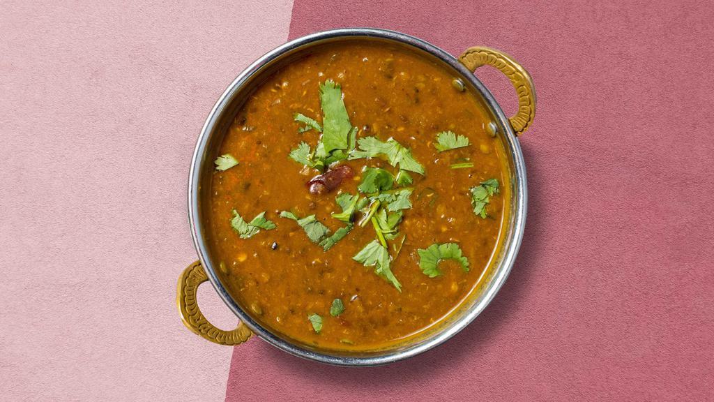 Never A Dal Moment · Slow simmered yellow lentils with onion and tomato.