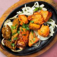 Eureka, Chicken Tikka! · Boneless pieces of our white meat chicken marinated in a yogurt and spices and roasted in a ...