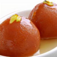 Kiss From A Rosewater · Deep fried cake balls in a honey syrup. Served hot.