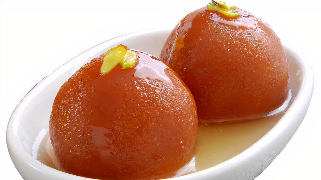 Kiss From A Rosewater · Deep fried cake balls in a honey syrup. Served hot.