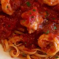 Shrimp Fra Diavolo Over Linguine · Shell fish in a spicy tomato sauce. ribbon pasta.