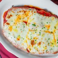 Pork Parmigiana · Made or covered with parmesan cheese.