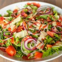 Arugula Salad · Red onions, tomatoes, asiago cheese, with white balsamic vinaigrette.