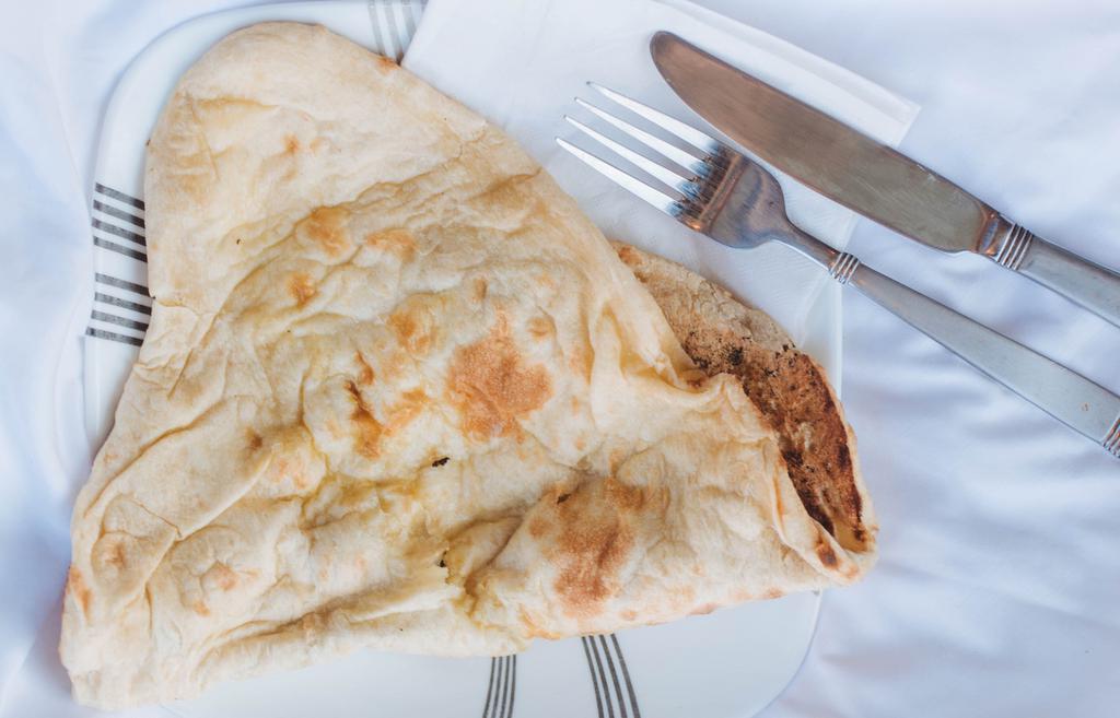 Naan · A traditional soft Indian bread.