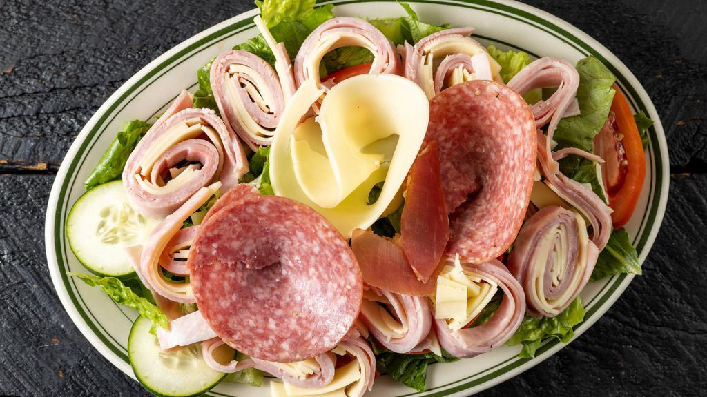 Italian Salad · Tomato, cucumber, olive, giardiniera, over lettuces topped with ham, salami, provolone.