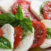 Caprese · Fresh mozzarella, roma tomatoes, fresh black pepper, basil, EVOO & balsamic glaze