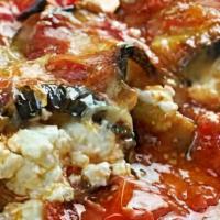 Eggplant Rollatini · Eggplant rolled with ham & ricotta inside topped with mozzarella & homemade tomato sauce