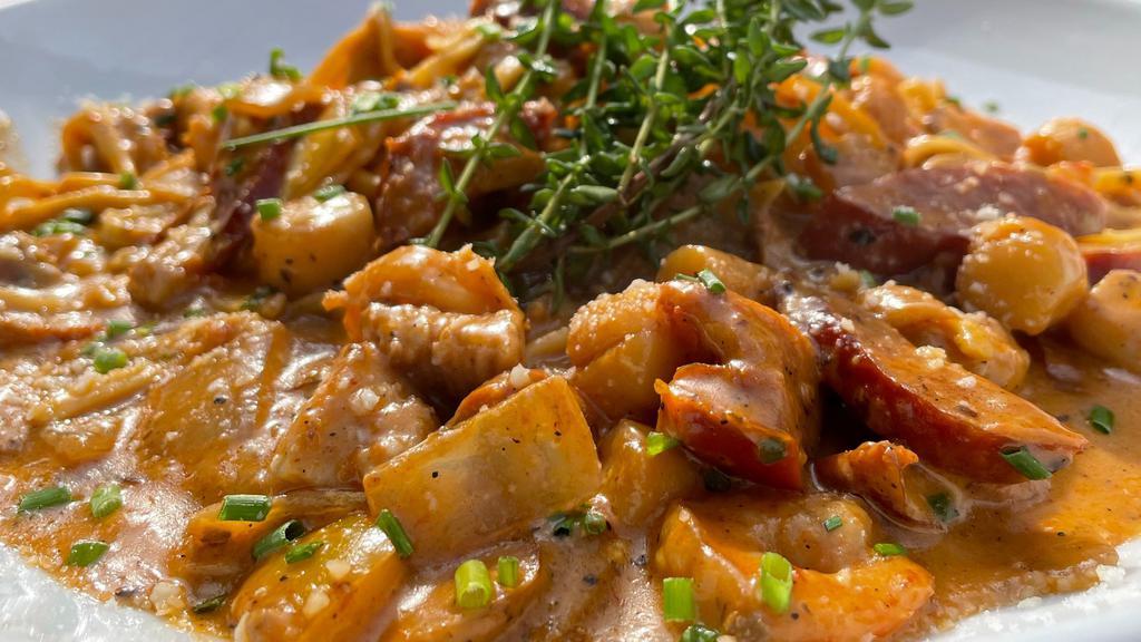 Jambalaya · Spicy.Linguini, shrimp, chicken, scallops, andouille sausage, onions, bell peppers, cherry tomatoes, cilantro, creamy Cajun sauce