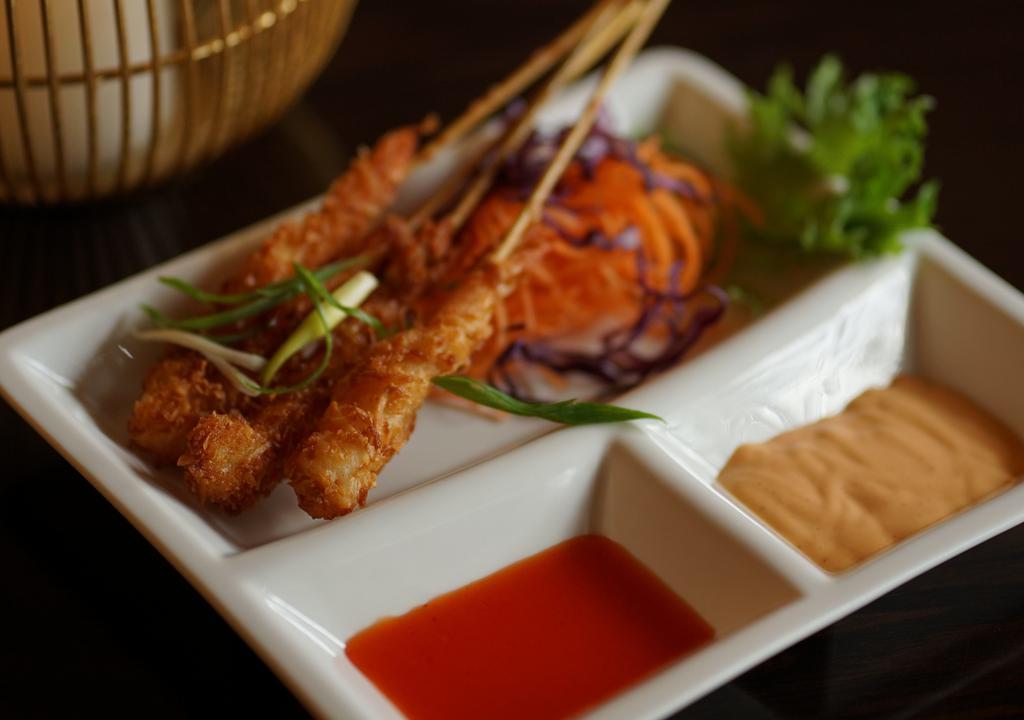 Coconut Shrimp · Fried Shrimp with Coconut Flakes served with Sweet Chili Sauce and Spicy Mayo.