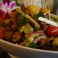 Yum Ped (Duck Salad) · Spicy. Crispy duck with chili paste, cashew nuts, pineapple, green apple, red onion, and sca...