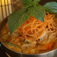 Massaman Curry · Spicy. Potatoes, peanuts, bell peppers, onion, carrots, and tamarind in coconut milk.
