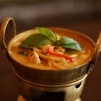 Red Curry · Spicy. Bamboo shoots, eggplants, bell peppers, carrots, and basil leaves in coconut milk.