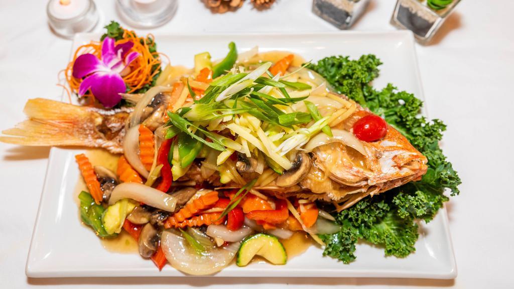 Pla Ginger · Crispy golden fish topped with fresh ginger, mushrooms, onion, and bell peppers in ginger sauce.