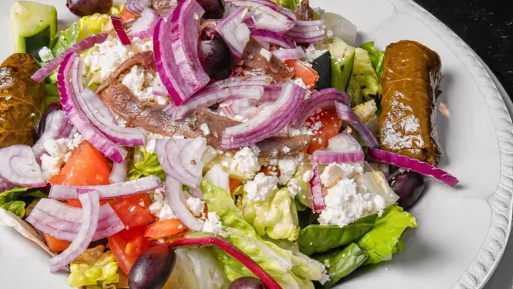 Greek Salad With Jumbo Shrimp (5) · Traditional Greek salad topped with (5)pieces of JUMBO shrimp. Served side of pita bread.