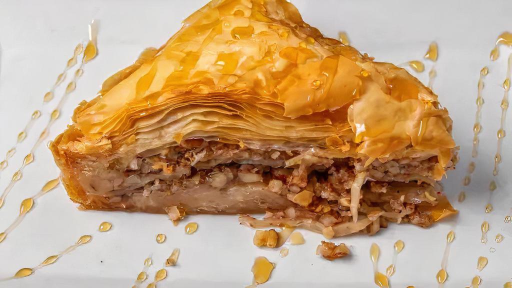 Baklava · A traditional Greek desert.. Flaky filo dough, honey, walnuts and cinnamon baked and saturated in honey.