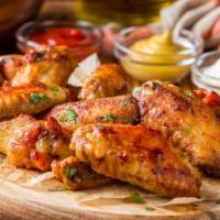 Crispy Fried Buffalo Wings · Buffalo wings fried to golden perfection. Served with spicy dipping sauce, celery sticks, an...
