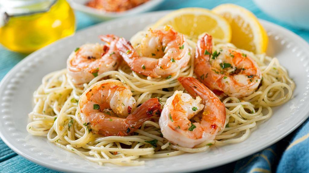 Broiled Jumbo Shrimps · Broiled jumbo shrimp with scampi sauce over rice.